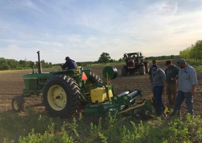 MBAF Farmers with Deere tractor